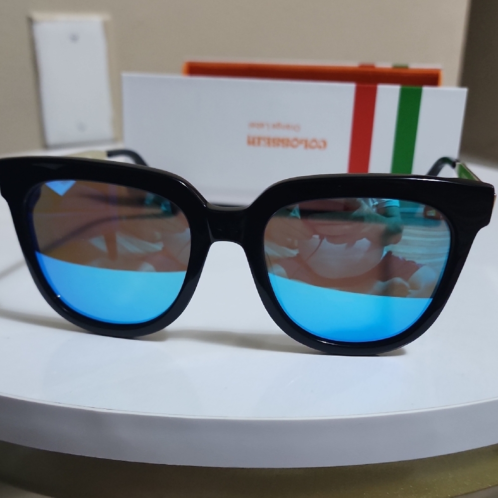 Stylish Black Sunglasses with Vibrant Blue Lenses